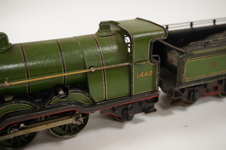 An 0 gauge Bing (or possibly Carette) for Bassett-Lowke tinplate clockwork GNR 4-4-2 tender locomotive, 1442, with original clockwork mechanism in yellow and black lined green livery